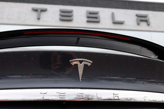 FILE - The company logo shines off the rear deck of an unsold 2020 Model X at a Tesla dealership in Littleton, Colo, on April 26, 2020. A conglomerate of unions in Norway on Wednesday Dec. 6, 2023 said it will take action against Tesla in solidarity with their Swedish colleagues who are demanding that the Texas-based automaker sign a collective bargaining agreement. (AP Photo/David Zalubowski, File)