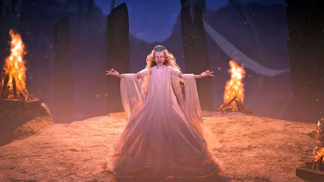 The Diva holds her hands out as she sings in the Grand Hub.