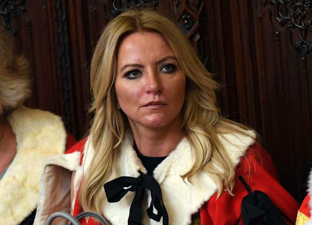 FILE - Baroness Michelle Mone looks on ahead of the State Opening of Parliament by Queen Elizabeth II, in the House of Lords at the Palace of Westminster in London, June 21, 2017. A member of Britain’s House of Lords has acknowledged that she repeatedly lied about her links to a company that was awarded lucrative government contracts to supply protective masks and gowns during the coronavirus pandemic. Underwear tycoon Michelle Mone said she had made an “error” in denying connections to the company PPE Medpro and regretted threatening to sue journalists who alleged she had ties to the firm. (Stefan Rousseau/PA Wire/PA via AP, File)