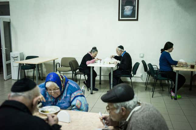 Fira and Lyova eating in the canteen at the Jewish retirement home where they are currently living.