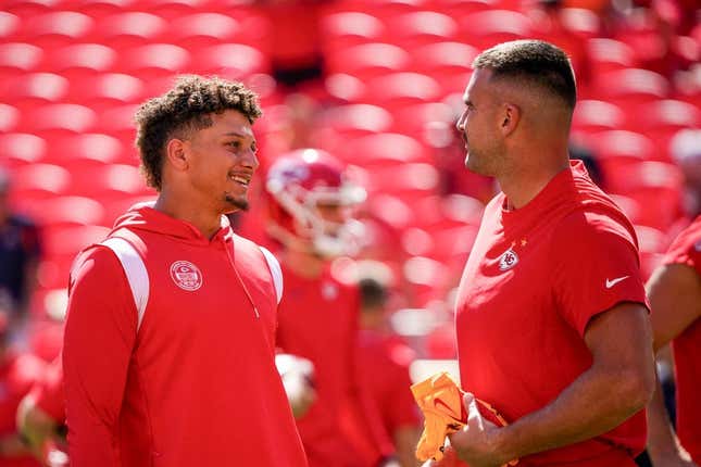 Sep 24, 2023; Kansas City, Missouri, USA; Kansas City Chiefs quarterback Patrick Mahomes (15) laughs with tight end Travis Kelce (87) against the Chicago Bears prior to a game at GEHA Field at Arrowhead Stadium.