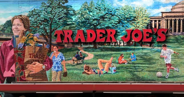 FILE - The Trader Joe&#39;s logo hangs on a mural, Aug. 13, 2019, in Cambridge, Mass. Trader Joe&#39;s recently upped the price to 23 cents for a single banana, marking a 4-cent increase from the grocer&#39;s previous going rate for the fruit that remained unchanged for over 20 years. (AP Photo/Charles Krupa, File)