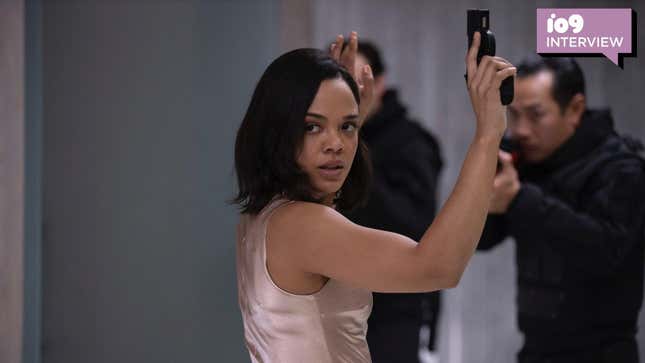 Tessa Thompson holds a gun with her hands in the air on Westworld.