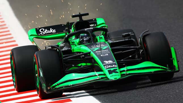 A photo of an F1 car spraying sparks in its wake. 