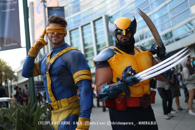 Cyclops and Wolverine stand at attention. 