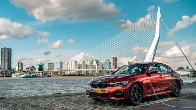 A photo of an orange BMW 330e hybrid in Rotterdam. 