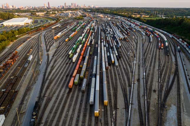 FILE - Freight train cars sit in a Norfolk Southern rail yard on Sept. 14, 2022, in Atlanta. Companies that have plants and facilities only served by one railroad may soon be able to get a bid from another railroad if their current service is bad enough under a new rule that was proposed Thursday, Sept. 7, 2023 to help boost competition. (AP Photo/Danny Karnik, file)