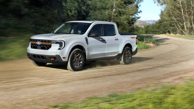 a white ford maverick driving on a dirt road