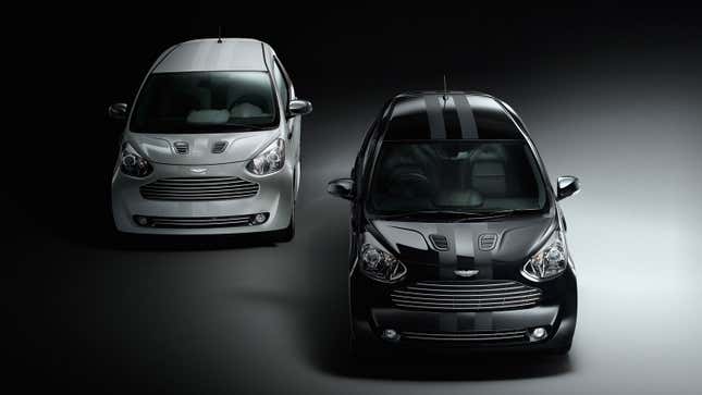 A black and a silver Aston Martin Cygnet city cars