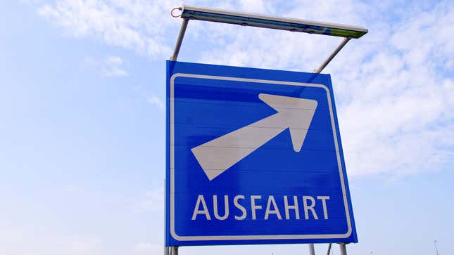 A photo of a blue road sign that says "Ausfahrt" on it. 