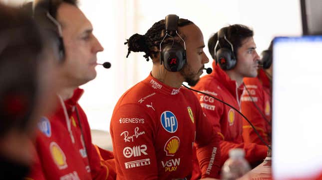 Lewis Hamilton sitting alongside Ferrari's engineers during test