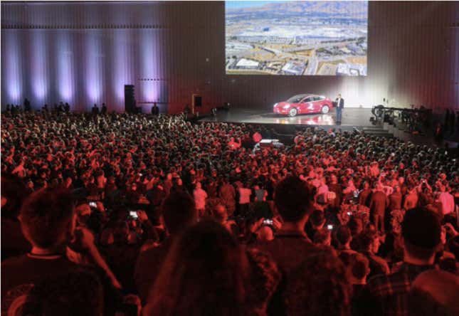 Tesla CEO Elon Musk presents the Model 3 at the company’s Fremont factory on July 28.