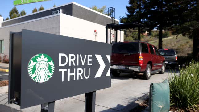 Customers line up in a drive thru at a Starbucks store on October 29, 2021 in Novato, California. 