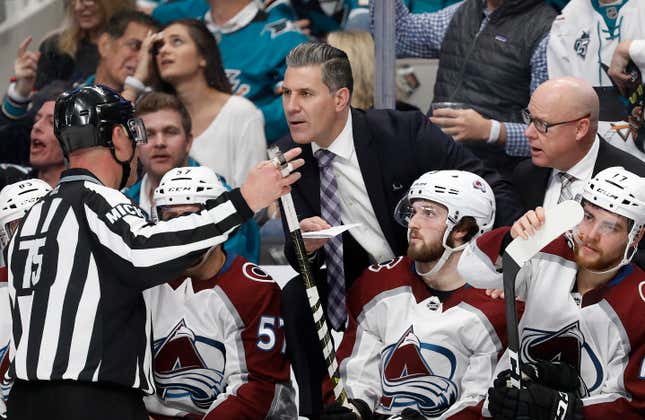 That iconic NHL image: A ref explaining an offside call spotted only on video review.