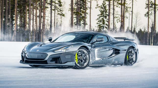 Front 3/4 view of a grey Rimac Nevera drifting in the snow