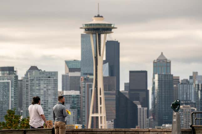 People take in a view of the skyline in Seattle. 