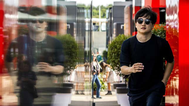 A photo of Yuki Tsunoda in the paddock at Silverstone. 