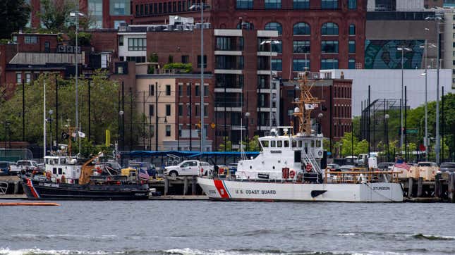 Two US Coast Guard vessels sit in port in Boston Harbor across from the US Coast Guard Station Boston in Boston, Massachusetts, on June 19, 2023. A submersible vessel used to take tourists to see the wreckage of the Titanic in the North Atlantic has gone missing, triggering a search-and-rescue operation, the US Coast Guard said on June 19, 2023