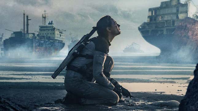 A woman (Nora Arnezeder) crouches in a destroyed landscape in the trailer for Colony.