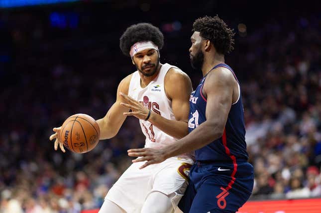 Nov 21, 2023; Philadelphia, Pennsylvania, USA; Cleveland Cavaliers center Jarrett Allen (31) controls the ball against Philadelphia 76ers center Joel Embiid (21) during the second quarter at Wells Fargo Center.