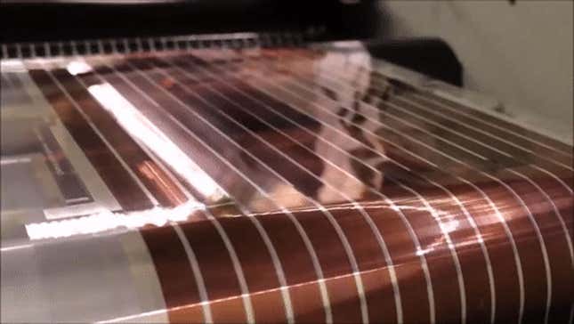 A gif showing solar cells being printed in a factory. 