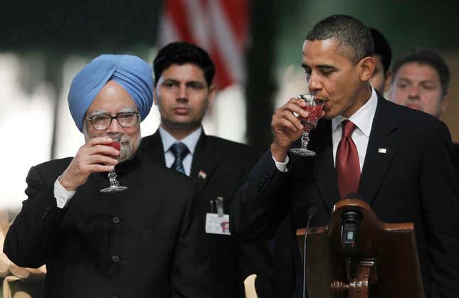 Drinking cautiously from the cup of international friendship.