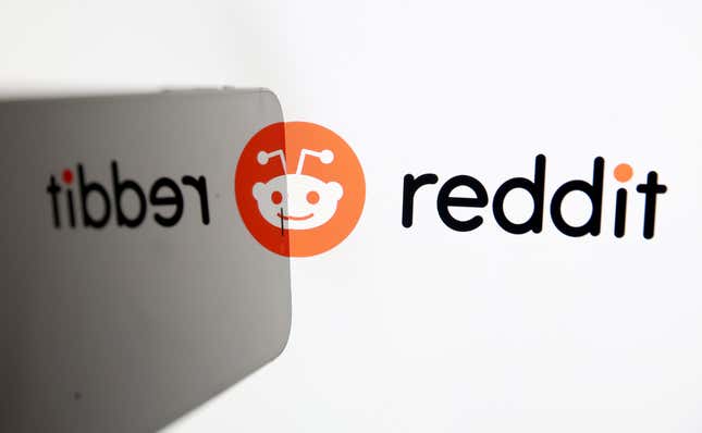 The Reddit logo is displayed on a computer screen.