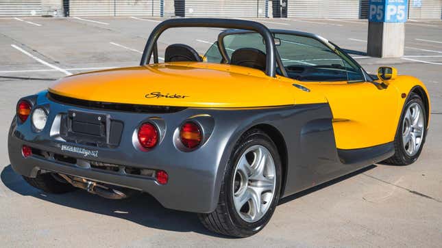 A rear three quarters of the spider showing its metallic gray rear end 