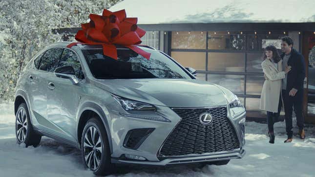 A massive novelty red bow atop a Lexus SUV for a December to Remember ad