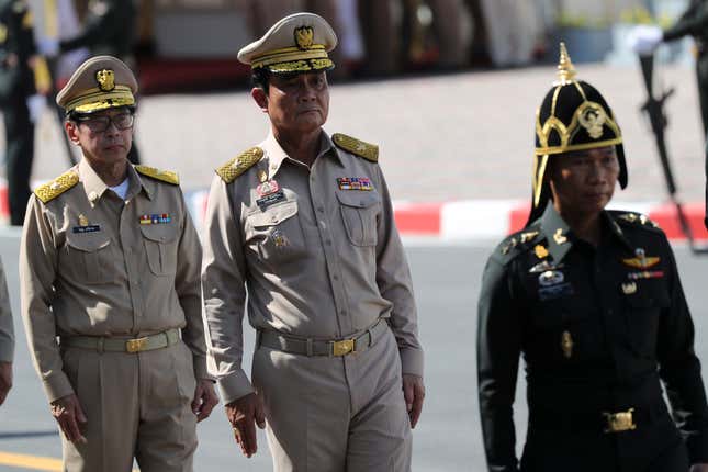 Thai Prime Minister Prayut Chan-o-cha (C) attends a training exercise with officers pulling the royal funeral chariot vehicle, which will be used in the procession for the royal funeral pyre of the late Thai King Bhumibol Adulyadej's cremation ceremony, in the area of the Grand Palace in Bangkok, Thailand, 15 October 2017. The royal cremation of King Bhumibol is scheduled on 26 October 2017, and the funeral will consist of five days of rites. King Bhumibol died at the age of 88 in Siriraj hospital on 13 October 2016 after 70 years on the throne. EPA-EFE/DIEGO AZUBEL