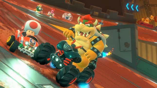 Bowser and a mushroom guy race in tiny carts.