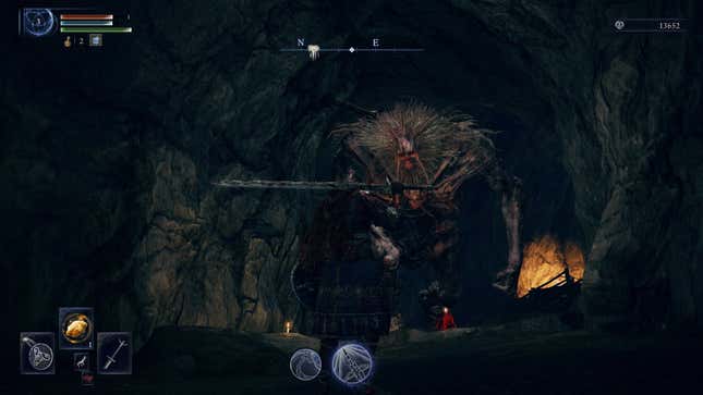 A giant boss moves through a cave.