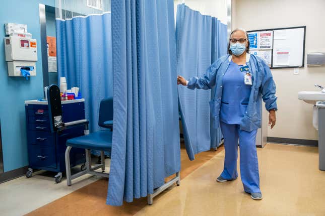 File - A nurse works in the laboratory room in El Nuevo San Juan Health Center at the Bronx borough in New York, Jan. 11, 2024. Health care providers — hospitals, doctors&#39; offices, and dentists — added a whopping 300,000 positions in recent months. (AP Photo/Eduardo Munoz Alvarez, File)