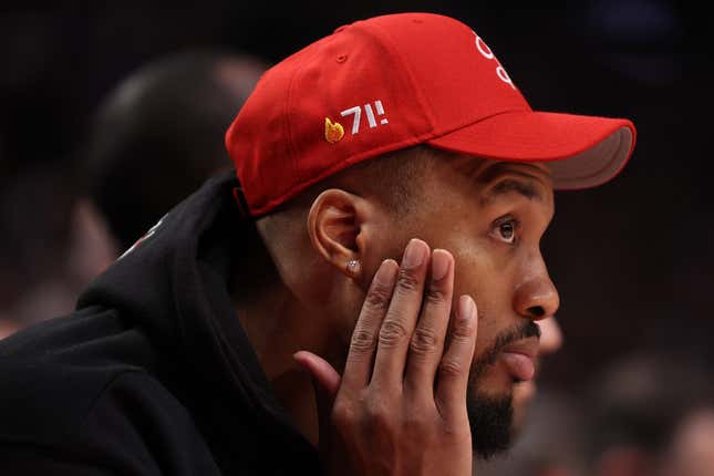 Damian Lillard #0 of the Portland Trail Blazers looks on during the third quarter against the Golden State Warriors at Moda Center on April 09, 2023 in Portland, Oregon. 