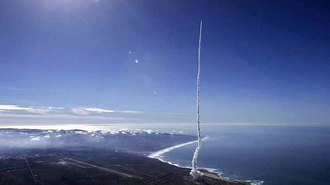 A photo of a Delta II rocket flying into space. 