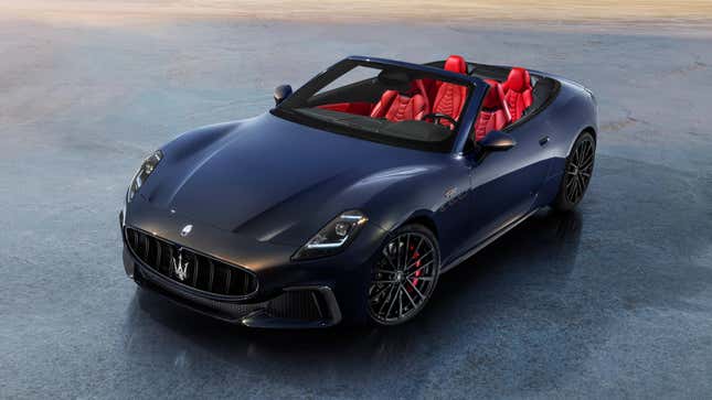 A photo of a GranCabrio in a dark color with a red interior