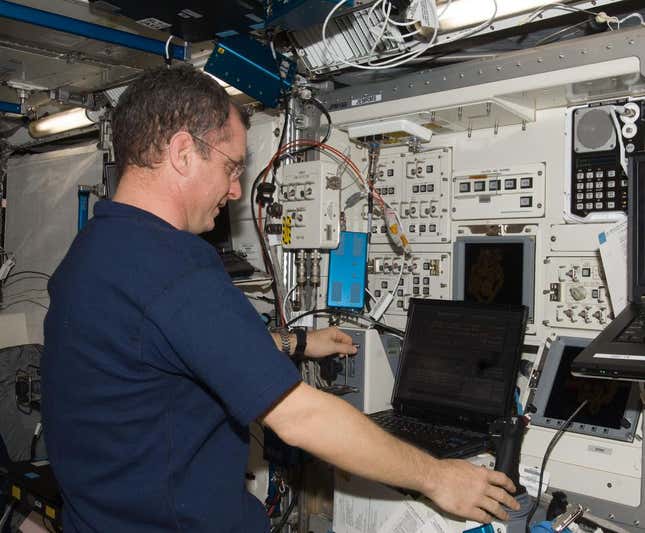 ISS022-E-090349 (11 March 2010) --- NASA astronaut T.J. Creamer, Expedition 22 flight engineer, uses a computer in the Kibo laboratory of the International Space Station.