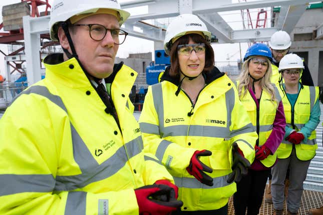 Labour leader Sir Keir Starmer, left, and shadow chancellor Rachel Reeves meet construction workers and apprentices during their visit to Panorama St Paul&#39;s, which is to be the new headquarters of the HSBC offices, in London, Thursday, March 7, 2024. Leading British economic think tanks are warning that whoever wins the country’s general election this year will face some very tough choices on tax and spending if they want to make sure the public finances don’t deteriorate further. (Stefan Rousseau/PA via AP)