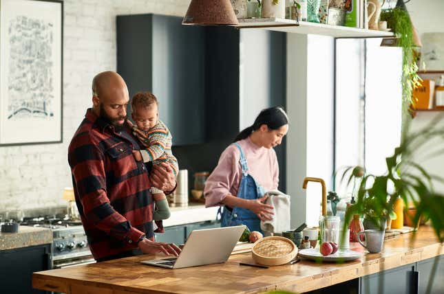 Millennial family cooking in kitchen