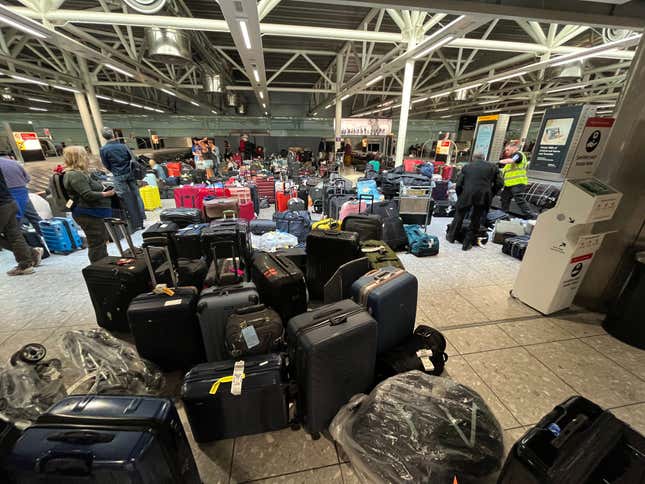 Suitcases are seen uncollected at Heathrow's Terminal Three baggage reclaim, west of London on July 8, 2022.