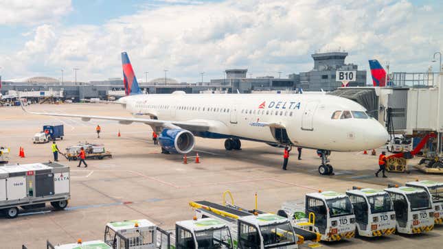 A delayed Delta Airlines plane sits on the tarmac at the Hartsfield-Jackson Atlanta International Airport on July 23, 2024 in Atlanta, Georgia.