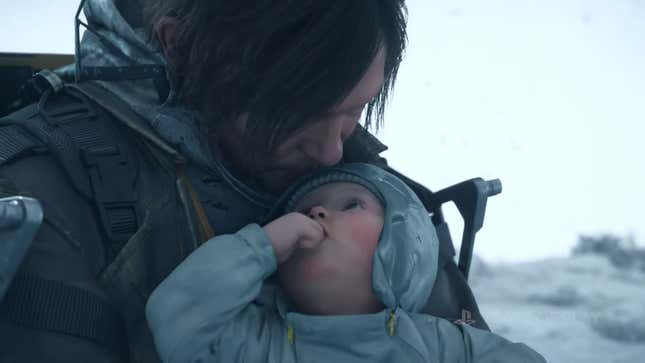 Sam Porter Bridges kisses a baby on the forehead.