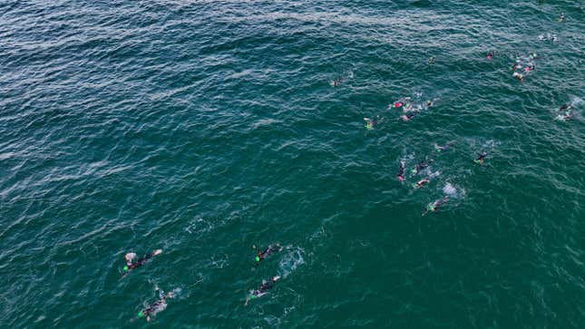 People swimming in the Gulf of Mexico off the coast of Panama City Beach, Florida, which is near Rosemary Beach