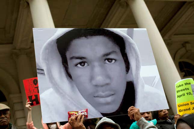 People along with New York City Council members attend a press conference to call for justice in the February 26 killing of 17-year-old Trayvon Martin in Sanford, Florida, on the steps of City Hall March 28, 2012 in New York City. 