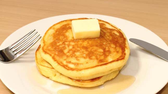 Stack of pancakes with pat of butter on top