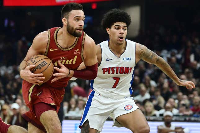 Nov 17, 2023; Cleveland, Ohio, USA; Cleveland Cavaliers guard Max Strus (1) drives to the basket against Detroit Pistons guard Killian Hayes (7) during the first half at Rocket Mortgage FieldHouse.