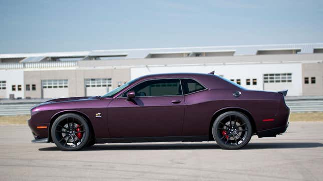 A metallic purple Dodge Challenger muscle car 