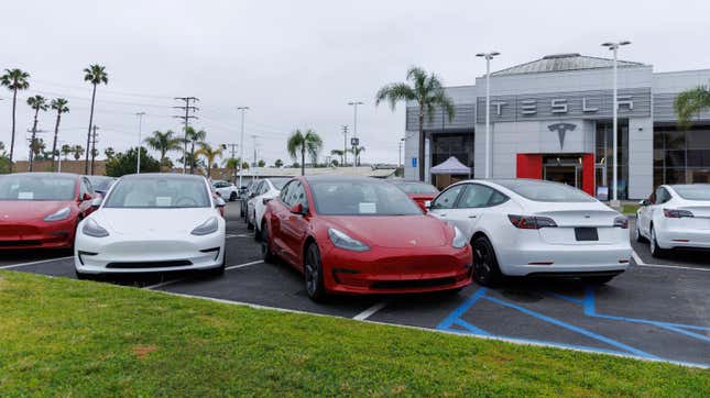 Tesla electric vehicles at a sales lot.