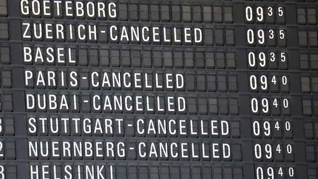 A photo of an airport departure board showing cancelled flights. 