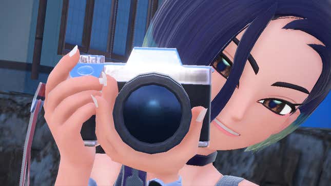 Perrin is shown holding her camera.